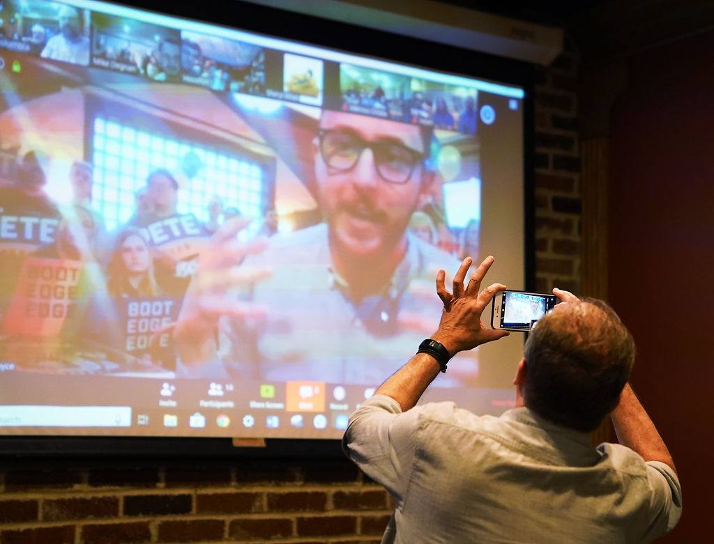 Keith Politte takes a photo during the Pete Buttigieg rally